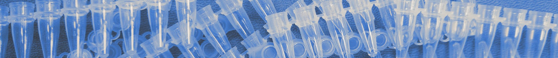 Close-up of a pile of clear PCR strip tubes.